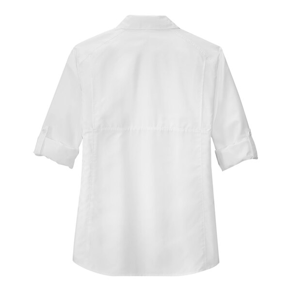 A white Port Authority short sleeve shirt with a collar.