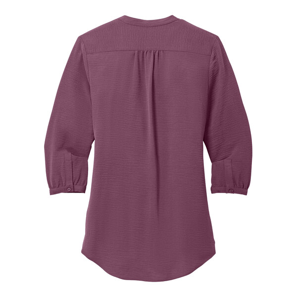A purple Port Authority blouse with short sleeves.