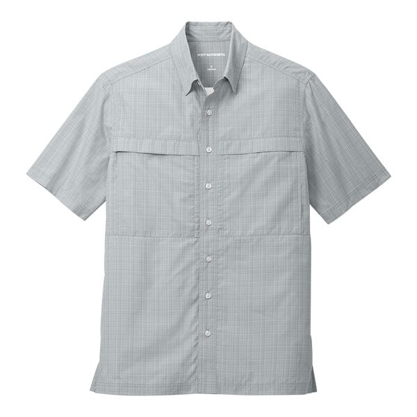 A close-up of a grey Port Authority short sleeve shirt with white checks.