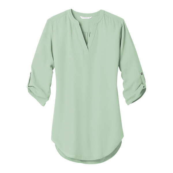 A close up of a Port Authority misty sage blouse with rolled sleeves.