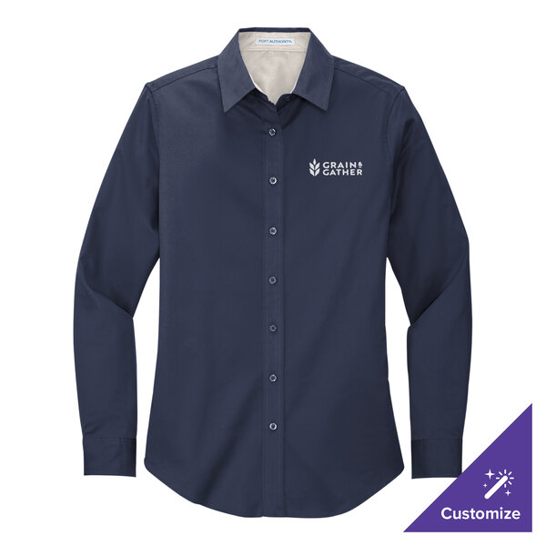 A navy Port Authority women's long sleeve dress shirt.