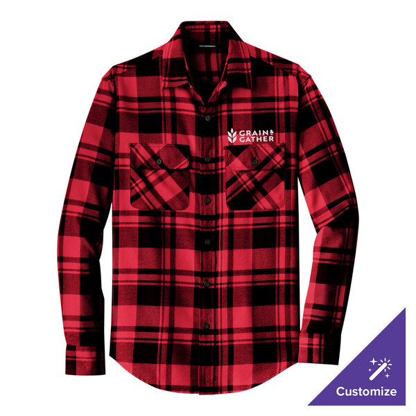 A Port Authority red and black plaid flannel shirt on a table.