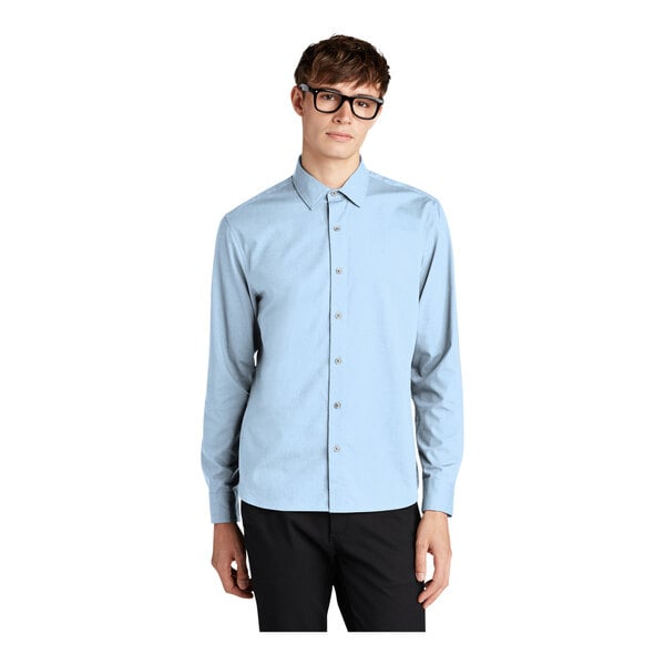 A man wearing a Mercer+Mettle light blue dress shirt.