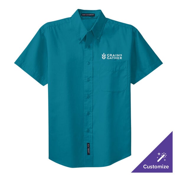 A teal Port Authority button-up dress shirt with white text on the front.