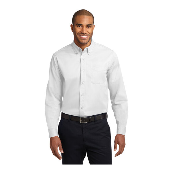 A man wearing a white Port Authority long sleeve poplin dress shirt.
