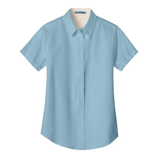 A light blue Port Authority short sleeve dress shirt for women with a tag.