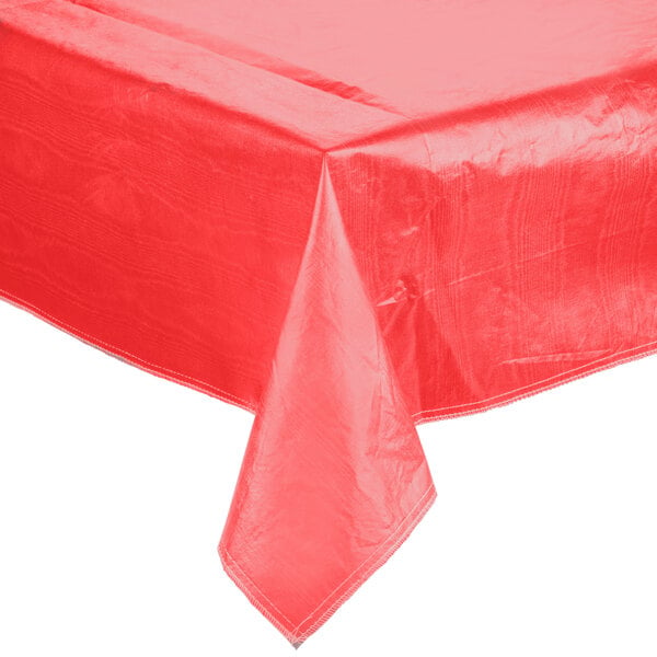 A red Intedge vinyl table cover on a white table.