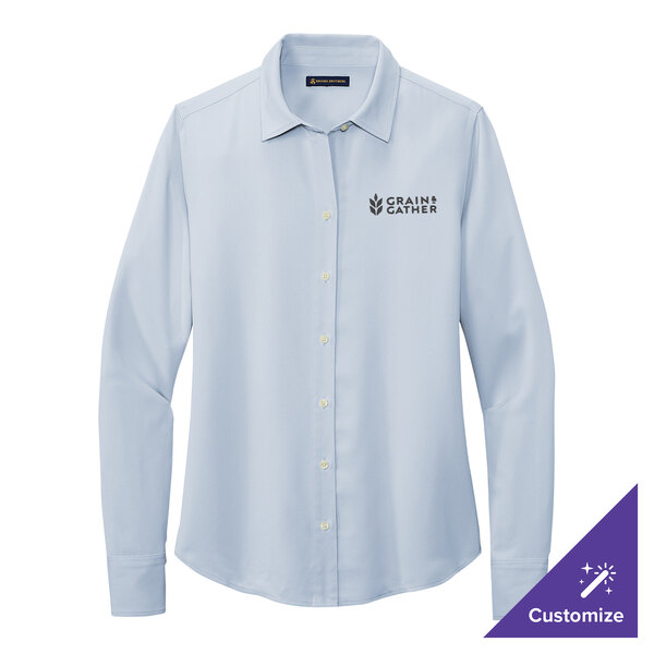A Brooks Brothers women's light blue long sleeve shirt with the word "Brooks" on the cuff.