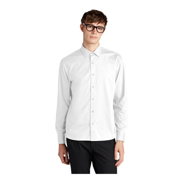 A man wearing a Mercer+Mettle white dress shirt.