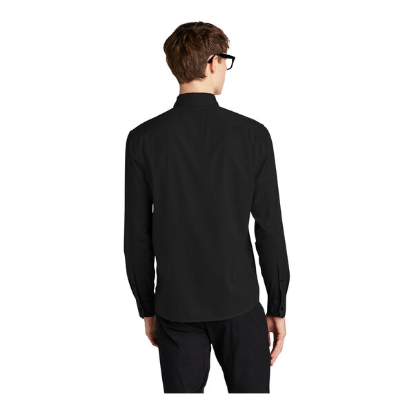 A man wearing a Mercer+Mettle black dress shirt.