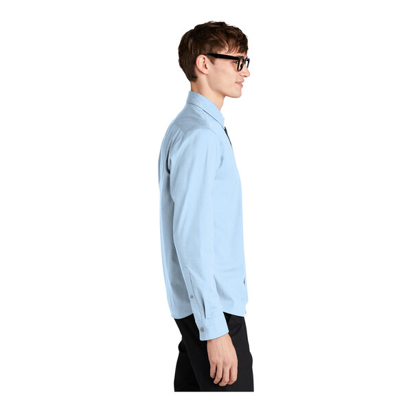 A man wearing a Mercer+Mettle air blue dress shirt.