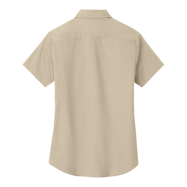 A tan Port Authority short sleeved dress shirt.
