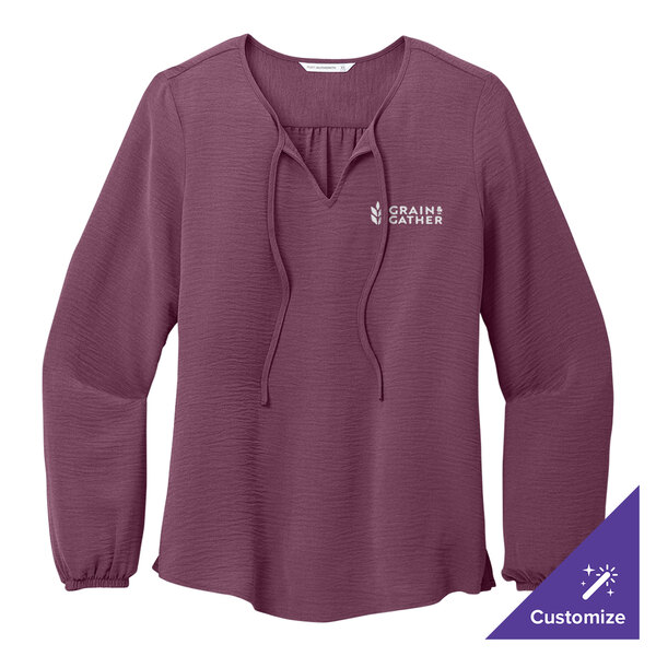 A purple Port Authority long sleeve shirt with a white logo on it.