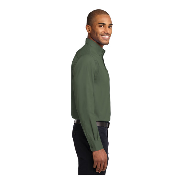 A man wearing a Port Authority Clover Green long sleeve dress shirt.