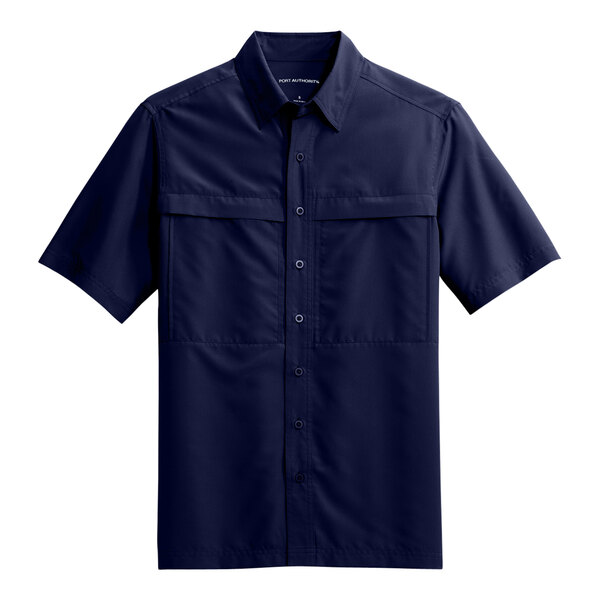 A navy blue short sleeved Port Authority shirt.