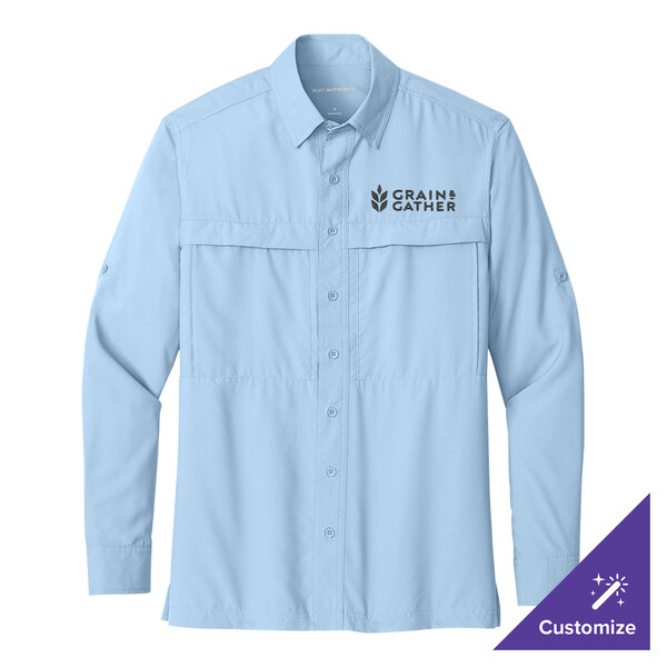 A small light blue Port Authority long sleeve shirt with a logo on the chest.