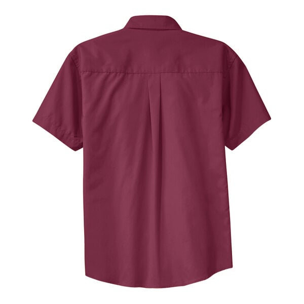 A Port Authority unisex short sleeve button-up dress shirt in burgundy and light stone.
