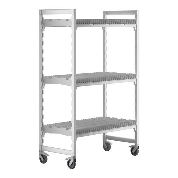 A white plastic Camshelving drying rack cart with shelves and wheels.