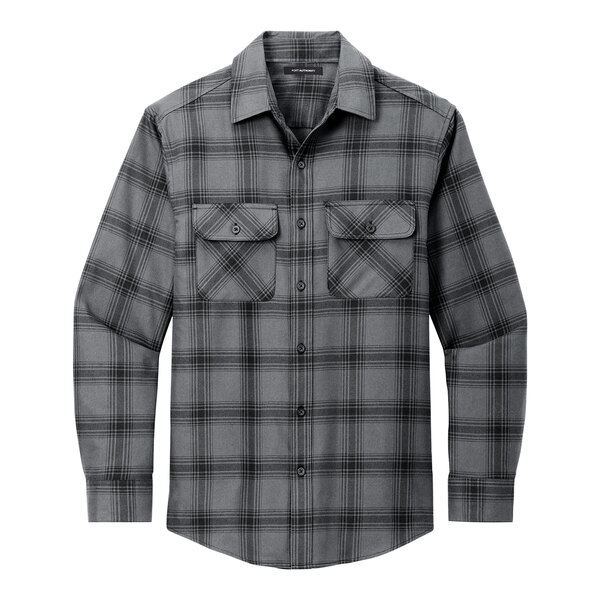 A Port Authority unisex long sleeve flannel shirt in grey and black plaid with a close up of a pocket.