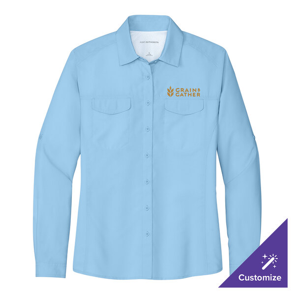 A light blue Port Authority long sleeve shirt with gold embroidery.