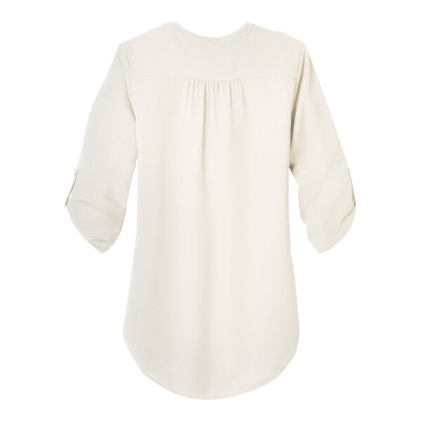 A back view of a white Port Authority chiffon blouse with ruffles on the short sleeves and collar.