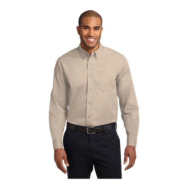 A man wearing a Port Authority long sleeve dress shirt in stone.