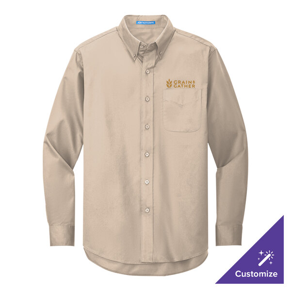A medium tan Port Authority long sleeve dress shirt with gold embroidery.