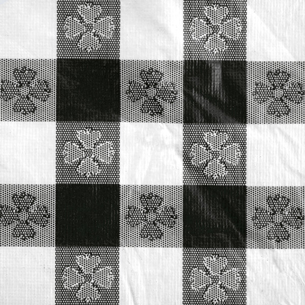 A white background with black and white checkered tablecloth with flowers.