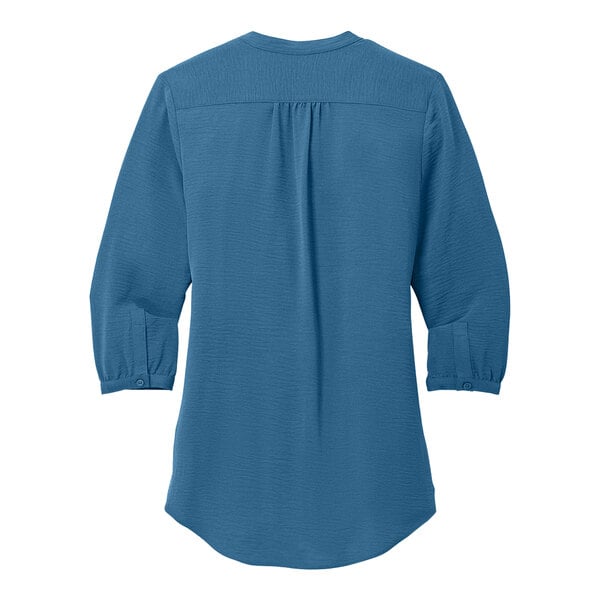 A Port Authority blue short sleeve blouse.