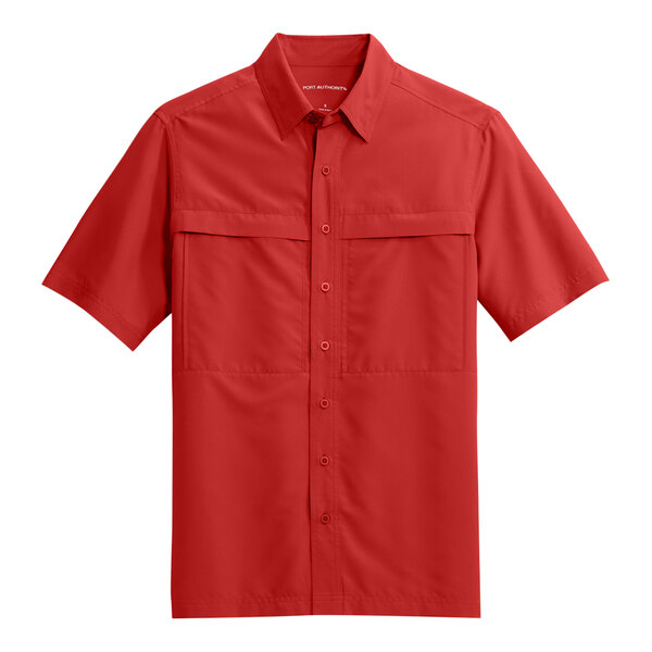 A unisex Port Authority red short sleeve shirt.