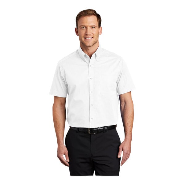 A man wearing a white Port Authority short sleeve dress shirt.
