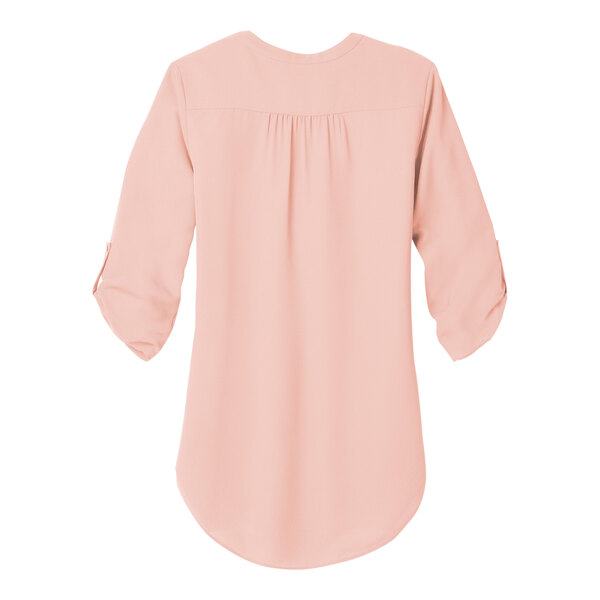 A back view of a Port Authority rose quartz blouse with ruffled sleeves.