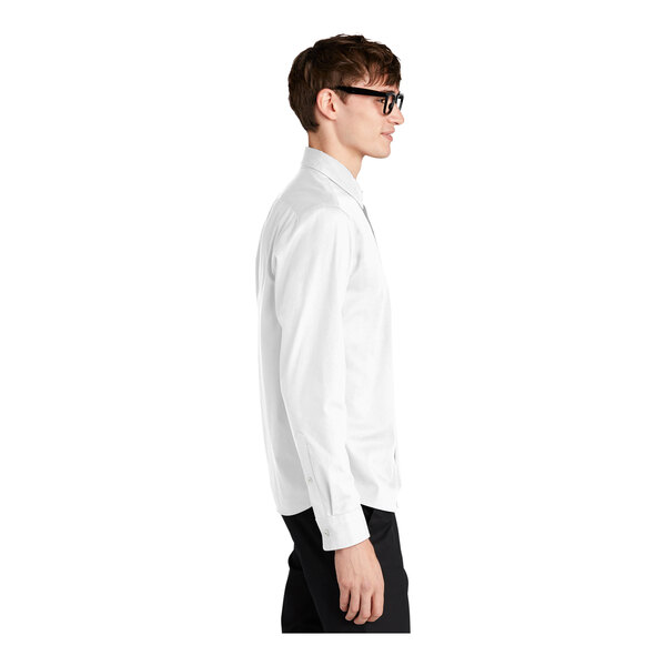 A man wearing a Mercer+Mettle white dress shirt.