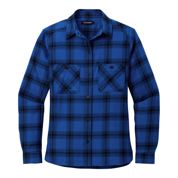 A close up of a button on a blue and black plaid Port Authority flannel shirt.