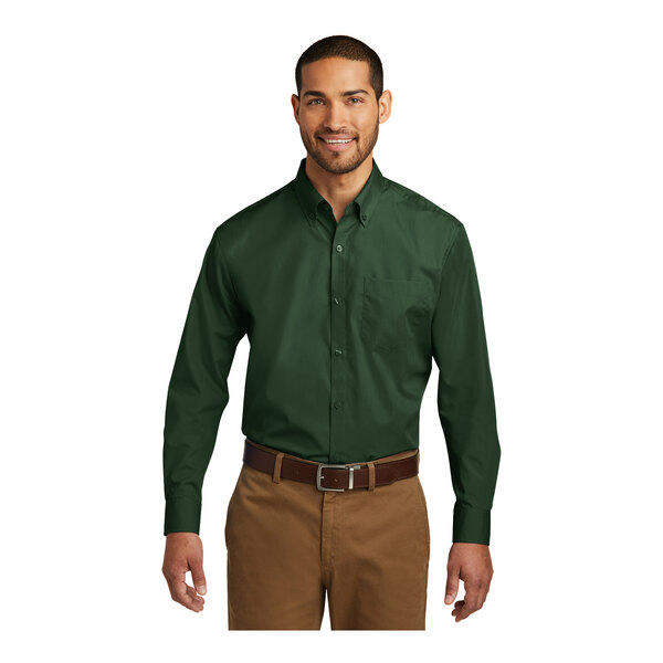 A man wearing a Port Authority long sleeve green poplin dress shirt.
