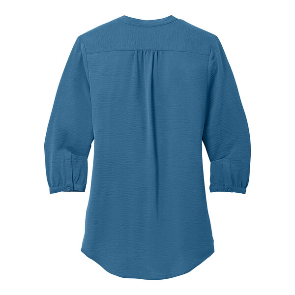 A Port Authority short sleeve blue blouse.