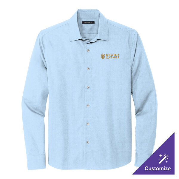 A Mercer+Mettle long sleeve light blue dress shirt with the word Goshen on it.