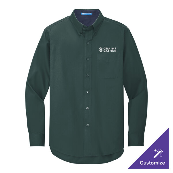 A medium dark green Port Authority long sleeve dress shirt with a logo on the chest.