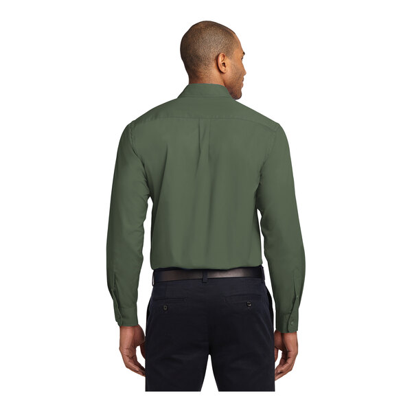 A man wearing a Port Authority Clover Green long sleeve dress shirt.