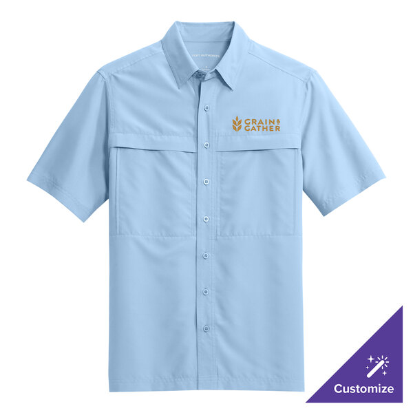 A light blue Port Authority short sleeve shirt with gold embroidery on the button.