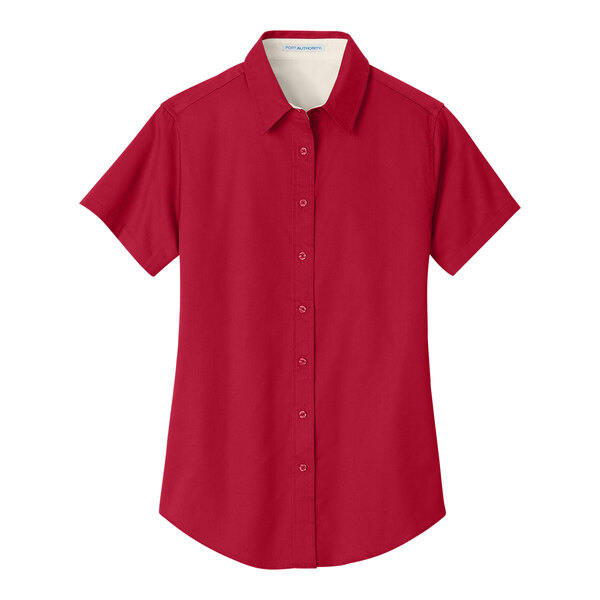 A Port Authority red and light stone short sleeve button down shirt for women.