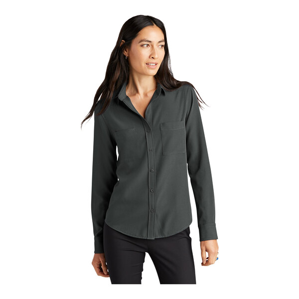 A woman wearing a Mercer+Mettle long sleeve gray camp blouse with an anchor pattern.