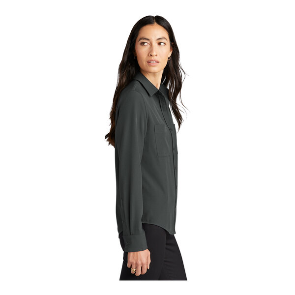 A woman wearing a Mercer+Mettle anchor gray long sleeve camp blouse.