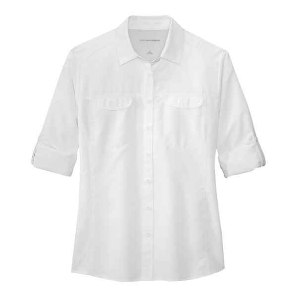 A white Port Authority short sleeve shirt for women with a button down collar.