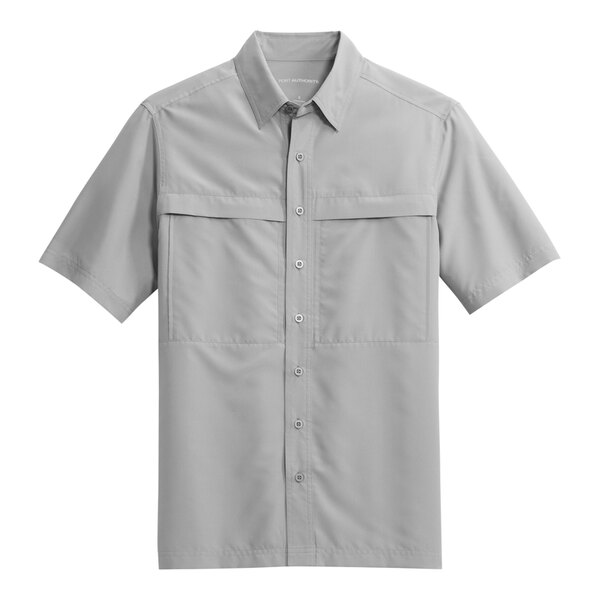 A close-up of a Port Authority unisex grey short sleeve shirt.