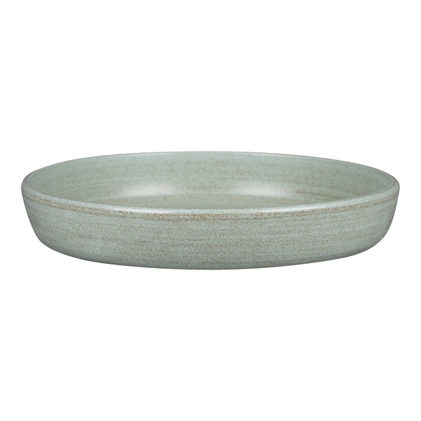 A Rakstone Selva porcelain deep coupe plate in aqua green with a light gray rim.