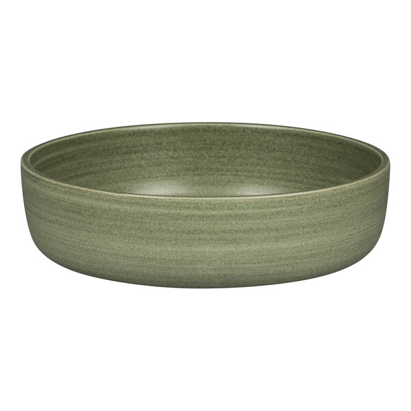 A close-up of a dark green Rakstone Selva porcelain bowl with a small rim.