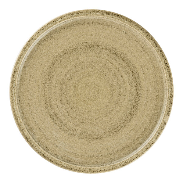 A close up of a beige Rak Porcelain flat coupe plate with a circular design.