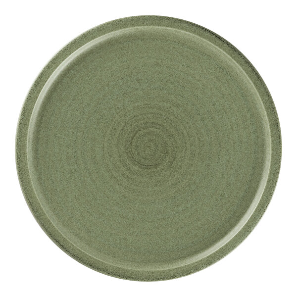 A close up of a dark green Rak Porcelain flat coupe plate with a spiral pattern.