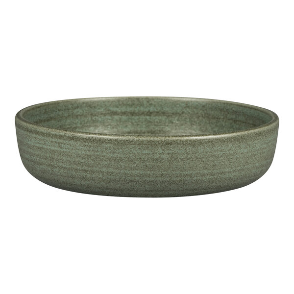 A close-up of a dark green Rak Porcelain bowl with a brown rim.